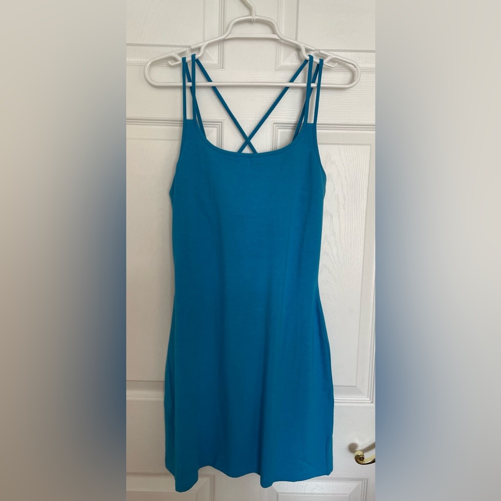 Turquoise bodycon dress with criss-cross straps in the back, never worn
